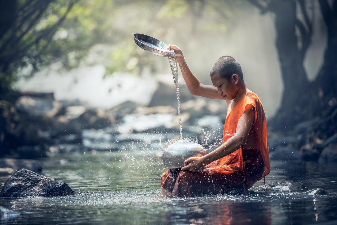 Monk child in stream